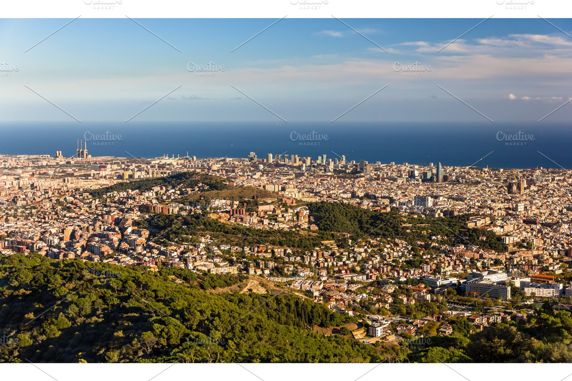 View of Barcelona including Sagrada Familia and Torre Agbar, an Architecture Photo by Leonid Andronov