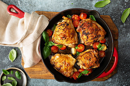 Chicken thighs roasted with tomatoes and garlic, a Food & Drink Photo by farwasser