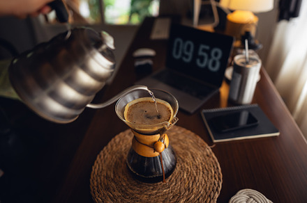 Drip coffee,Pouring water into filter coffee maker, a Food & Drink Photo by Art Rachen
