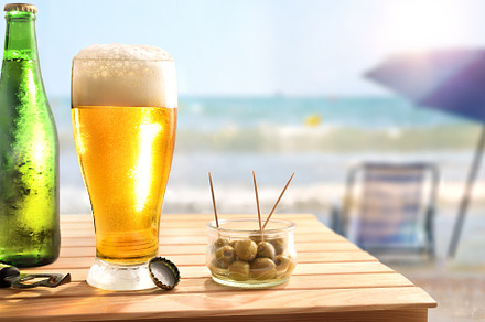 Beach bar concept with wooden table with beer and olives, a Food & Drink Photo by Davizro's Market