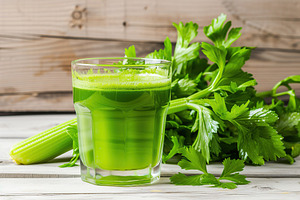 Fresh celery juice in glass on wooden table, a Food & Drink Photo by AlyaAnd