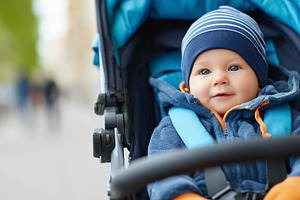 Happy baby in a blue stroller, a Person Photo by MistyDay