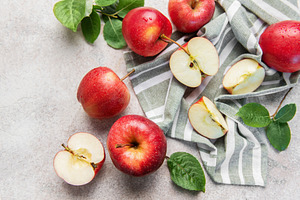 Red apples on striped cloth showing freshness and health, a Food & Drink Photo by Olena Rudo