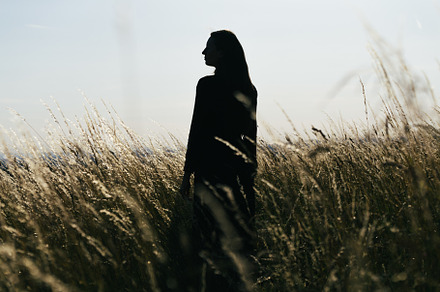 Woman relaxing in the field in smmer