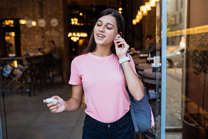 Beautiful girl with wireless headpho
