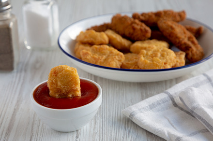 Homemade Chicken Strips and Nuggets with Ketchup, a Food & Drink Photo by LiudmylaChuhunova