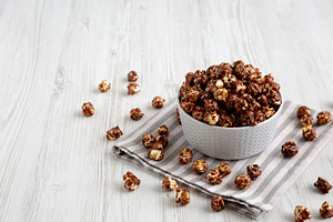 Homemade Chocolate Caramel Popcorn Ready to Eat in a Bowl, side, a Food & Drink Photo by LiudmylaChuhunova