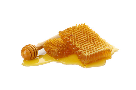 Dipper and honeycombs isolated on white background, a Food & Drink Photo by AtlasStudio