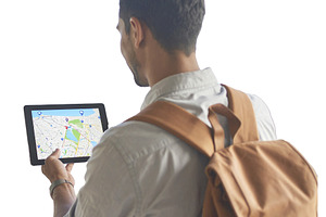 Traveler holding a tablet with map isolated photo, a Technology Photo by DanFLCreativo