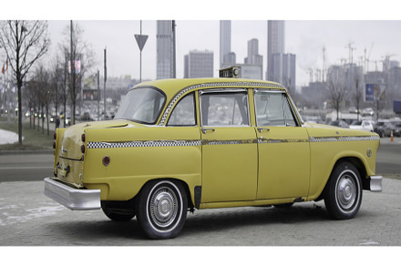 Classic yellow checker cab rotating, a Transportation Photo by Media Whale Stock