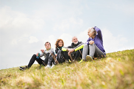 Group of senior runners outdoors resting and talking stock photo containing, a Person Photo by HalfPoint