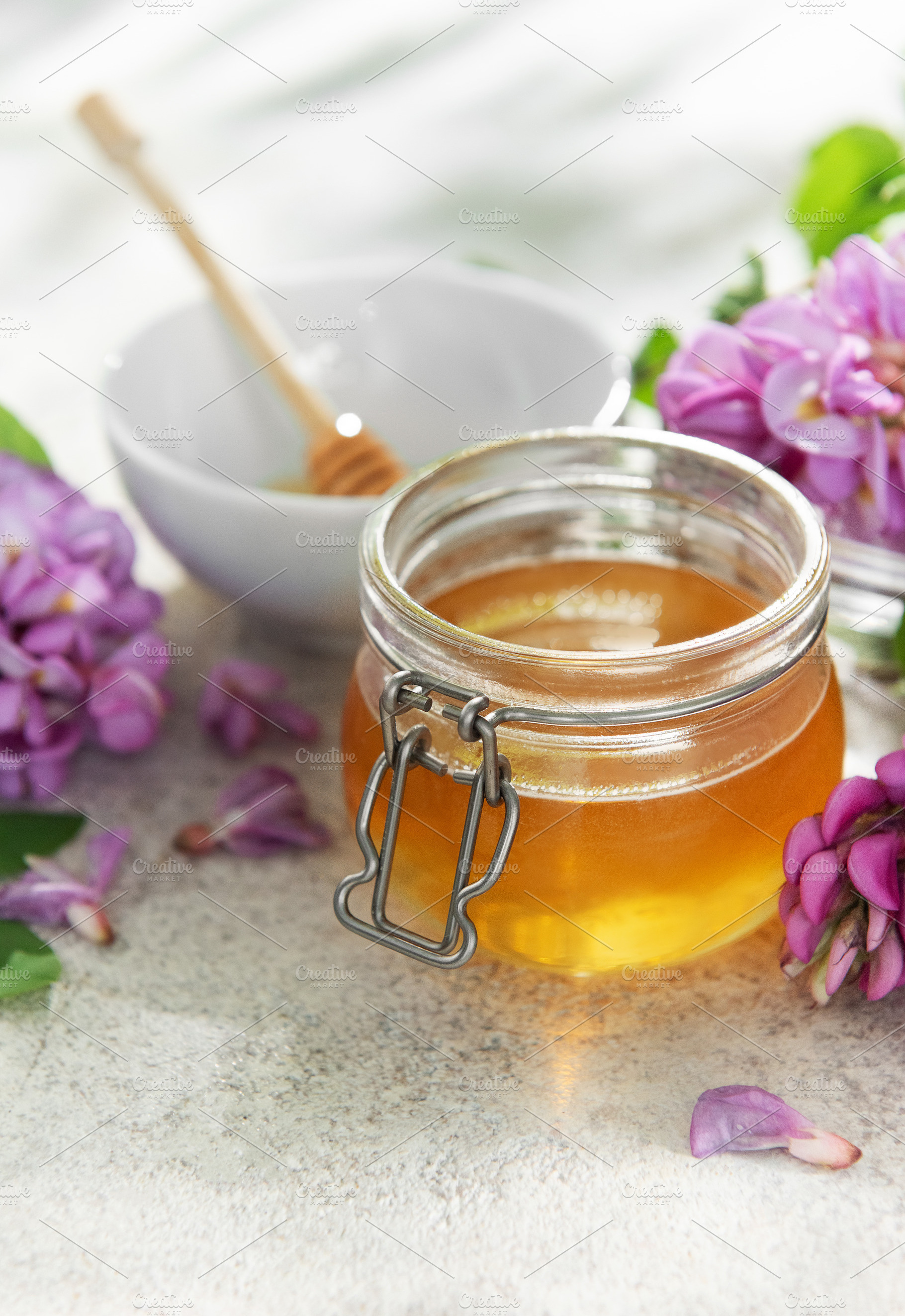 Organic honey jar with fresh blooming acacia flowers, a Food & Drink Photo by Olena Rudo