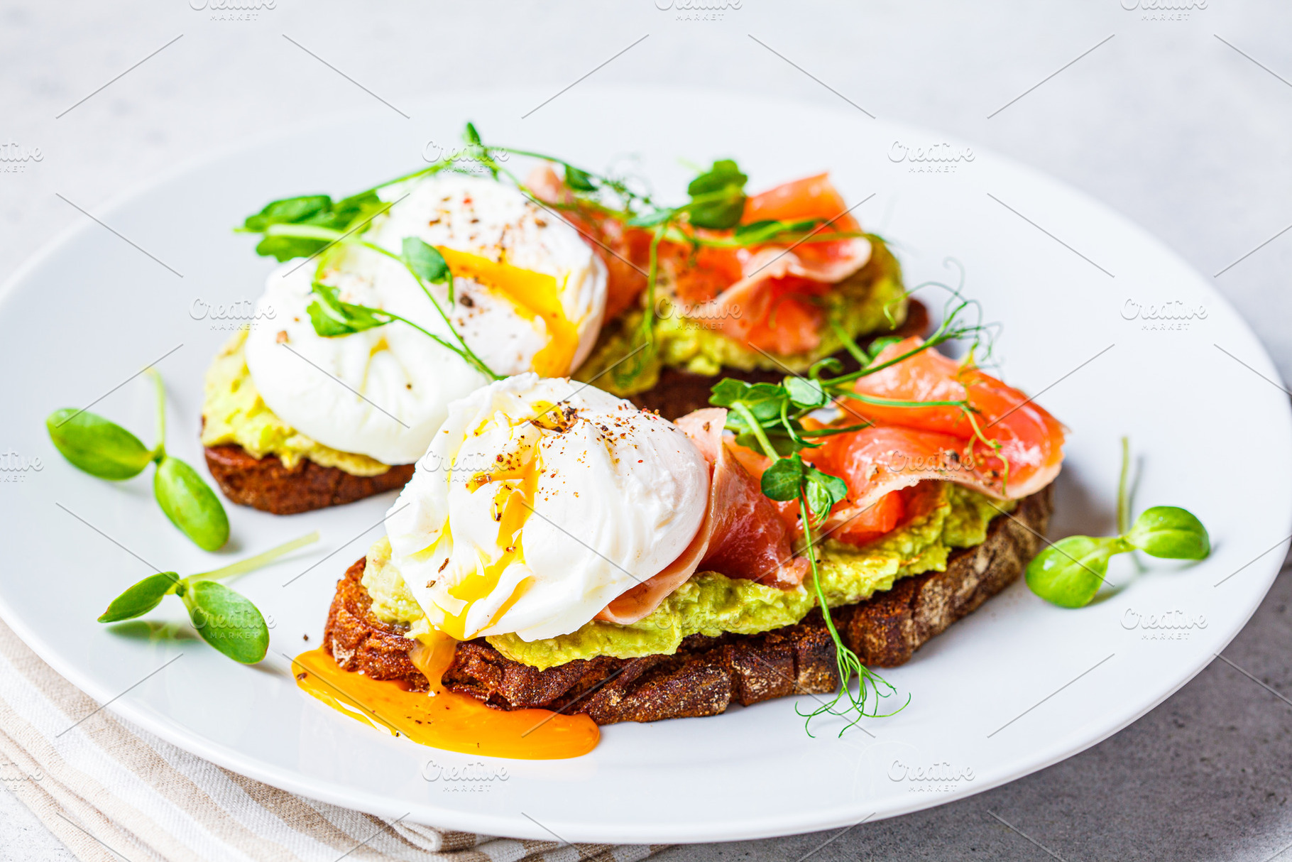Toast with salmon and poached egg containing appetizer, avocado, and avocado, a Food & Drink Photo by vaaseenaa