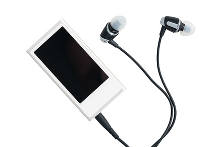 Small mp3 music player and earbuds featuring music, player, and mp3, a Technology Photo by Backyard Stock