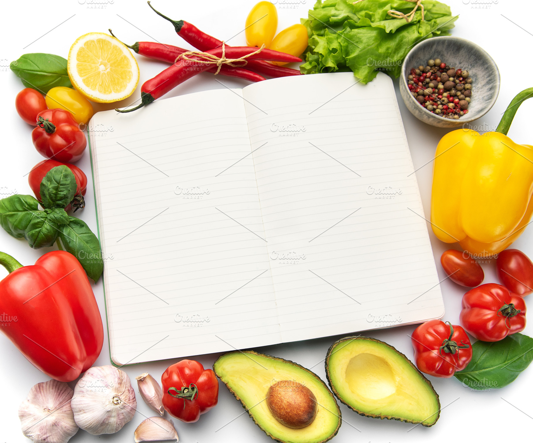 Open recipe book surrounded by fresh vegetables ingredients, a Food & Drink Photo by Olena Rudo