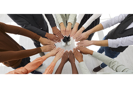 People each reach out with two of, a Person Photo by StudioRomantic