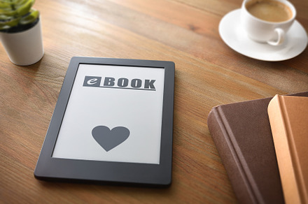 Concept of love for reading with ebook on wooden table, a Technology Photo by Davizro's Market