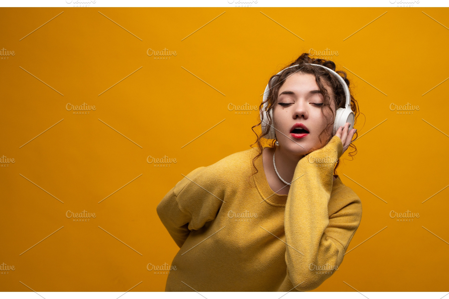 Young woman enjoying music with, a Person Photo by volodymyrshtun13795