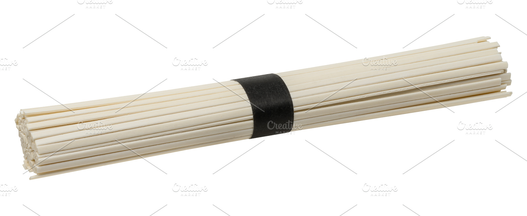 A bunch of dry white rice noodles tied tightly with a black pape, a Food & Drink Photo by ndanko