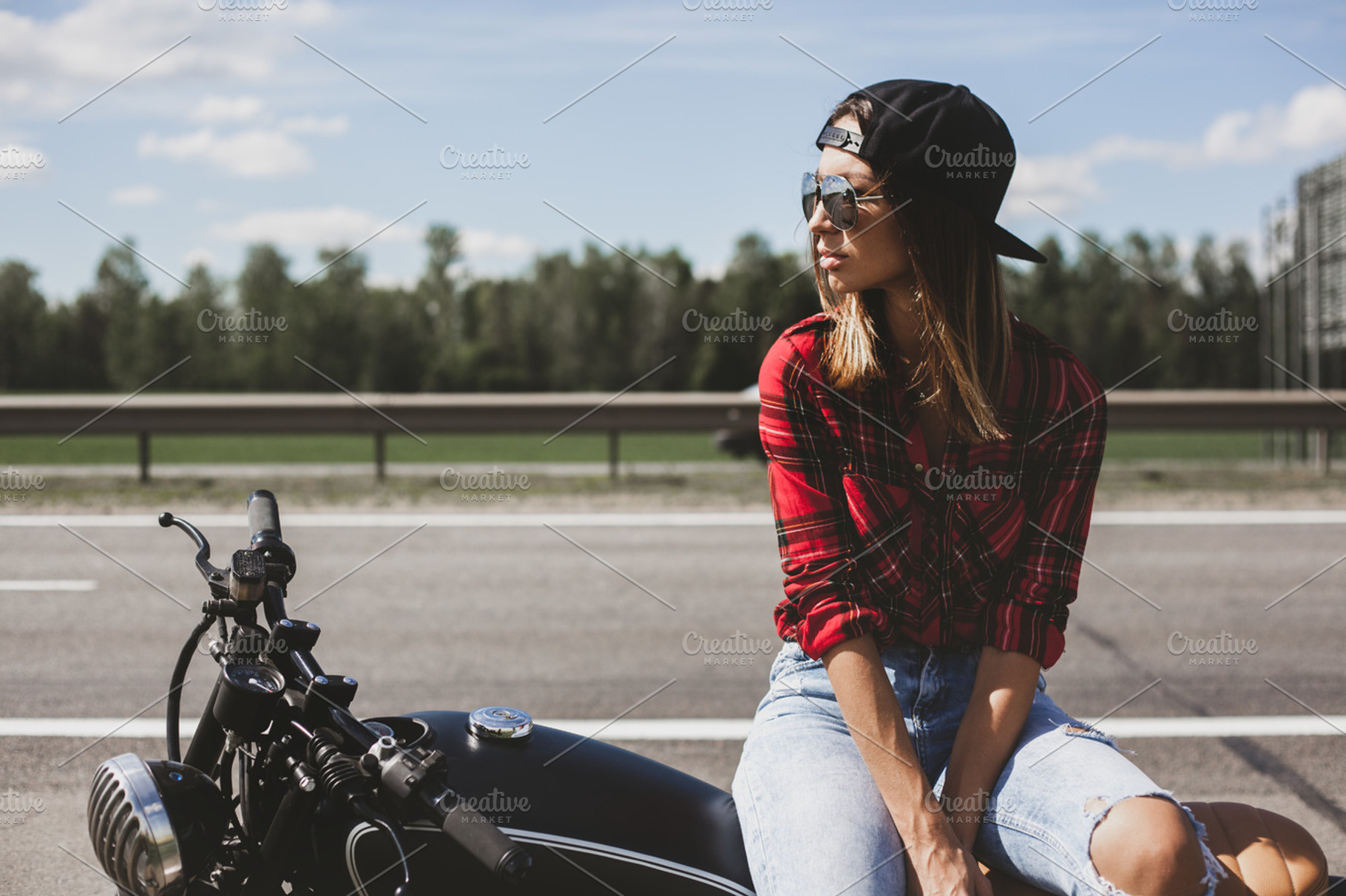 Biker girl sitting on motorcycle featuring woman, fashion, and retro, a Person Photo by Aliaksei Kaponia