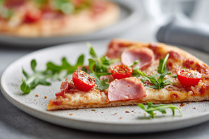 Pizza slice with ham, cherry tomato, a Food & Drink Photo by MistyDay