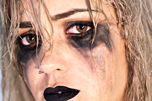 Woman with makeup spoiled by tears featuring woman, portrait, and tears