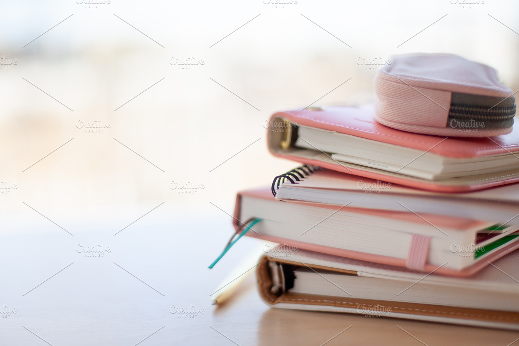 stylish designed coral and white coloured stack of diaries with, a Beauty & Fashion Photo by Natalia Kostikova