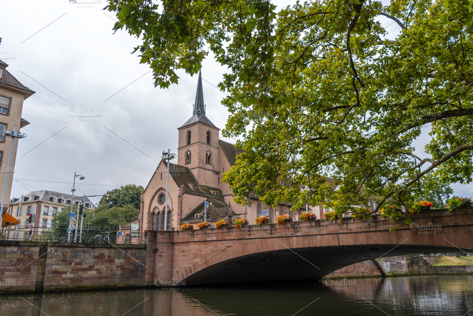 Saint Nicholas Church and bridge over the Ill river Strasbourg,, an Architecture Photo by GoodGoods