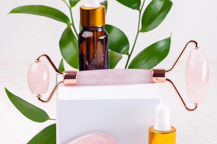 Rose quartz crystal facial roller and massage tool Gua sha, home skin care conc, a Health & Medical Photo by iuliia_n