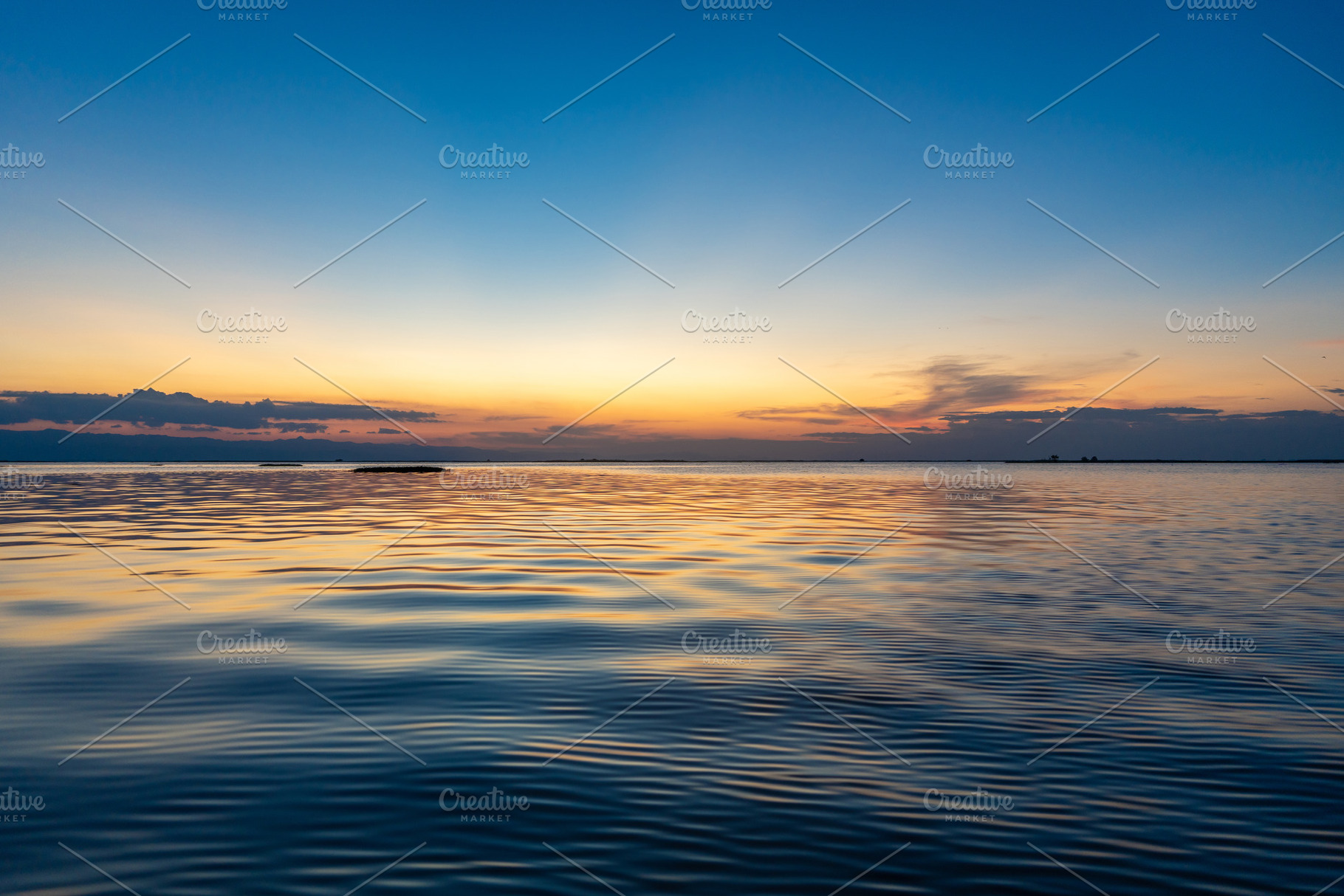 Sunset over Lake Tempe in Sulawesi, Indonesia, a Nature Photo by GoodGoods