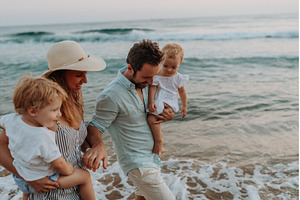 A family with two toddler children, a Person Photo by HalfPoint