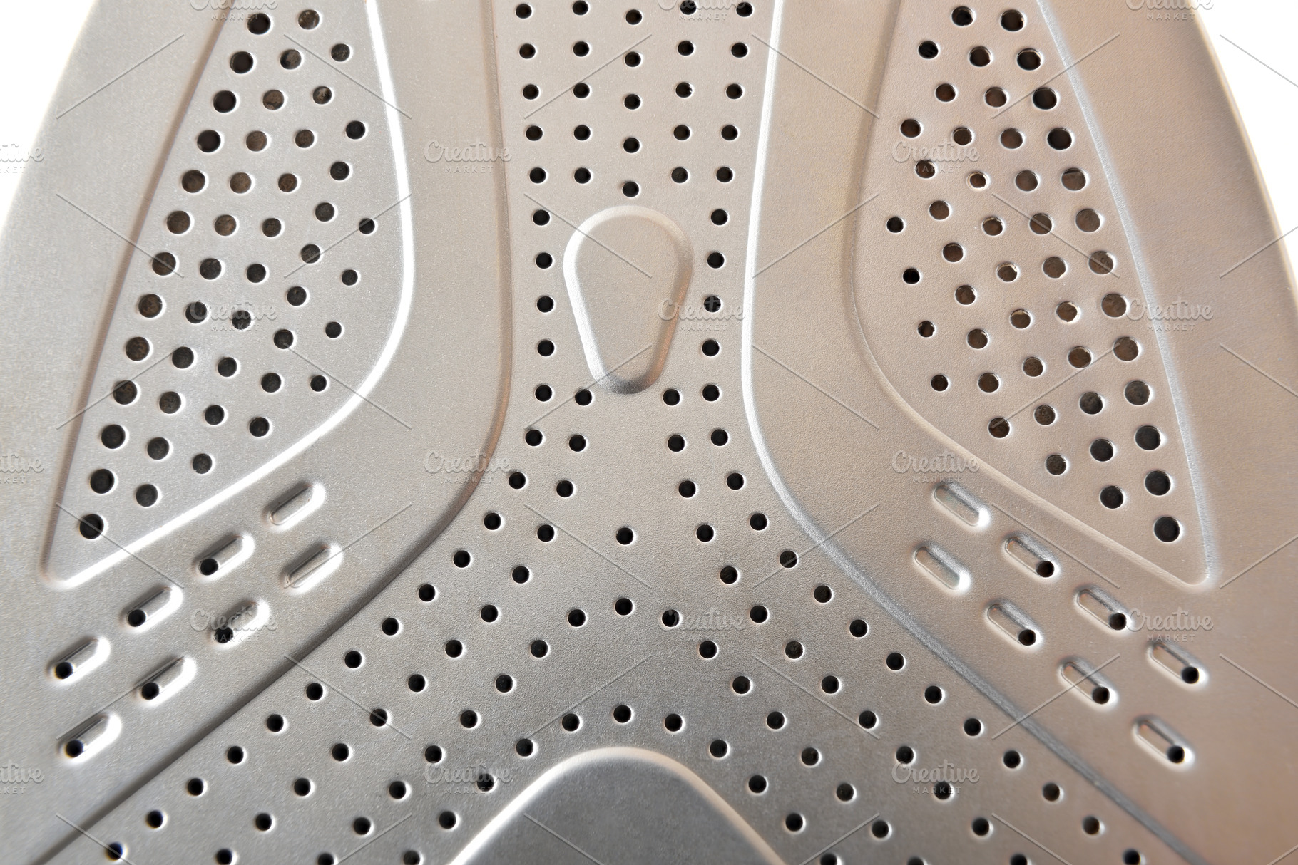 Detail of metal soleplate of a steam iron, a Sports & Recreation Photo by Davizro's Market