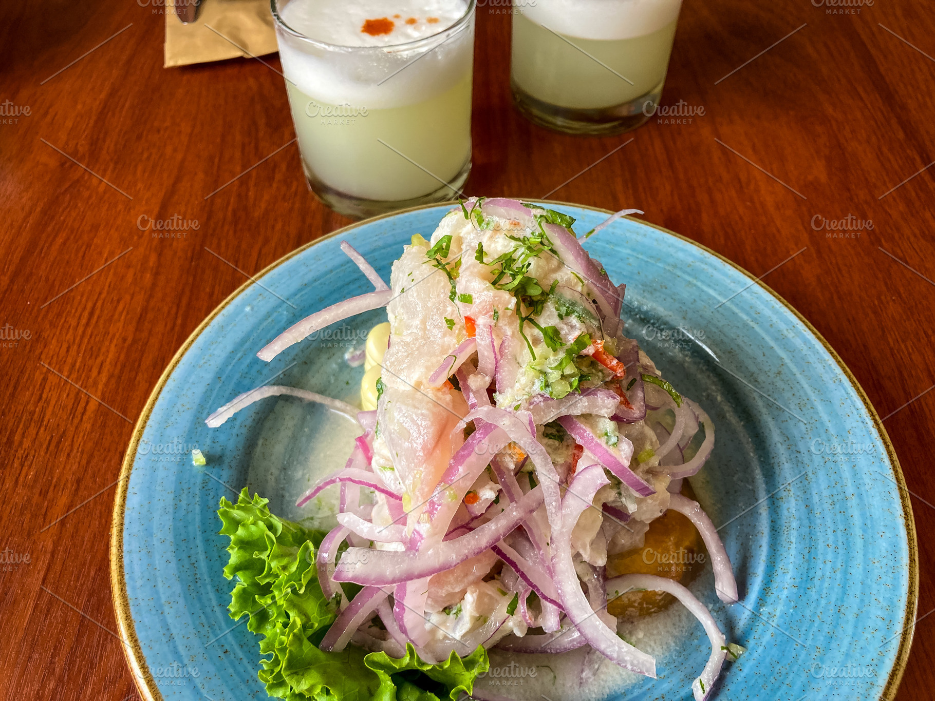 Traditional Peruvian ceviche with pisco sour in a Lima restauran, a Nature Photo by GoodGoods