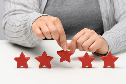 Customer experience feedback concept. Five red stars, the best r, a Person Photo by ndanko