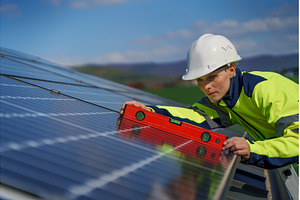 Woman engineer installing a solar, an Industrial Photo by HalfPoint