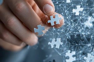 Hand placing puzzle pieces connectin, a Photo by Pixeness Studio