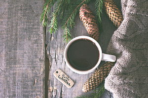 Coffee cones cozy knitted blanket containing marshmallow, hot, and cocoa
