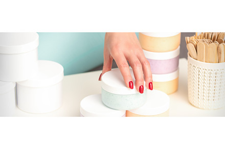 Beautician's hand takes jar with, a Beauty & Fashion Photo by okskukuruza
