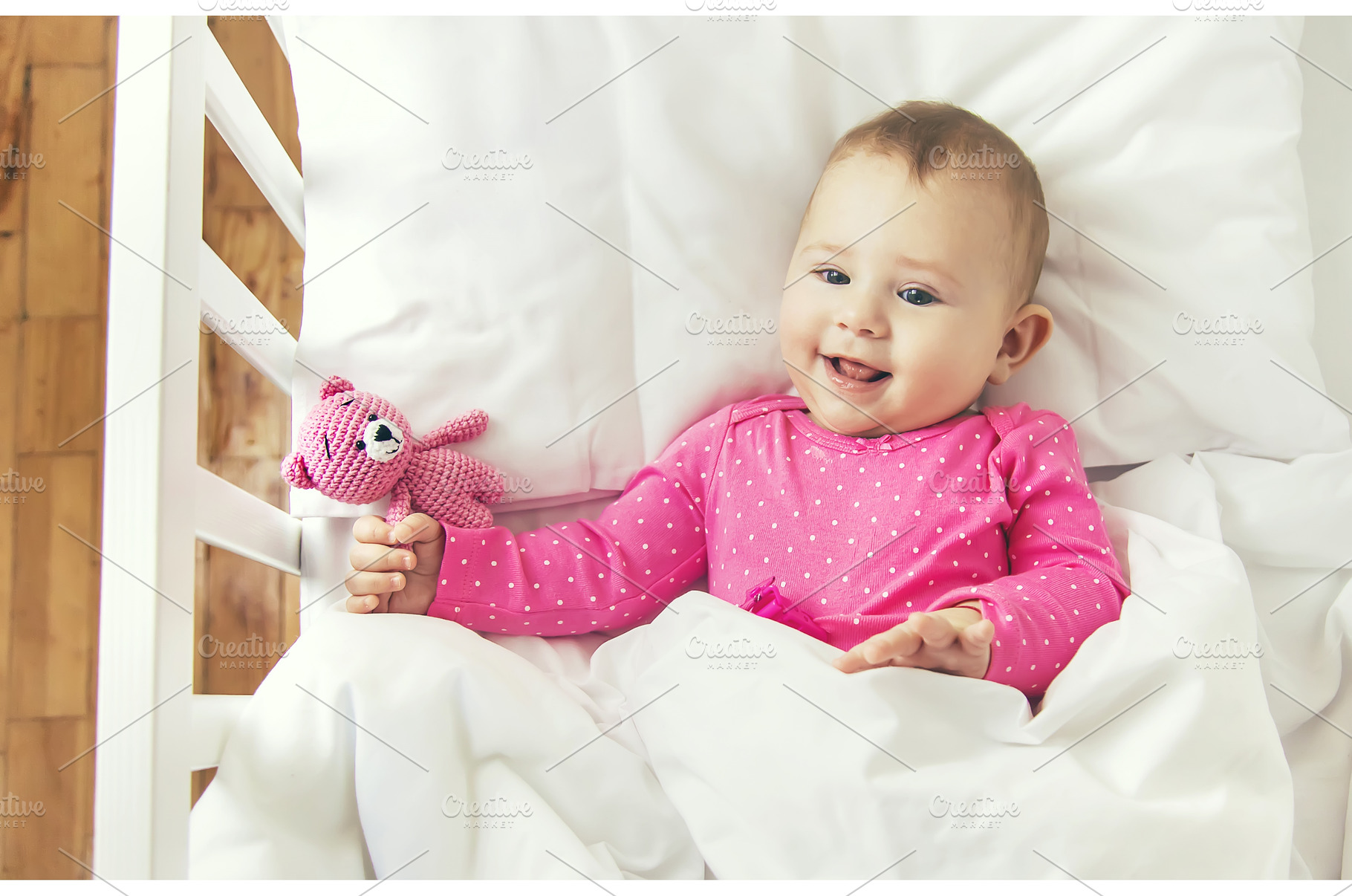 Baby toddler plays in the crib, a Person Photo by yanadjana