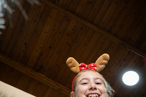 Happy girl looking inside Christmas decoration box, a Holiday Photo by etorres69