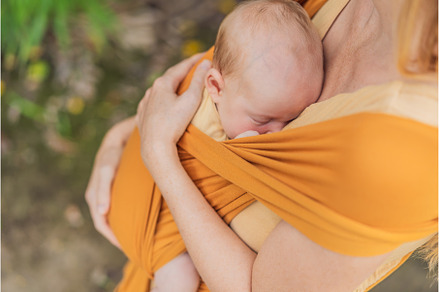 Mother holding her little baby in a