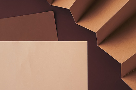 Beige and brown A4 papers as office stationery flatlay, luxury b, a Business Photo by Anneleven