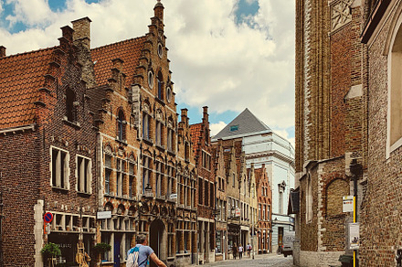 Man biking in ancient european town