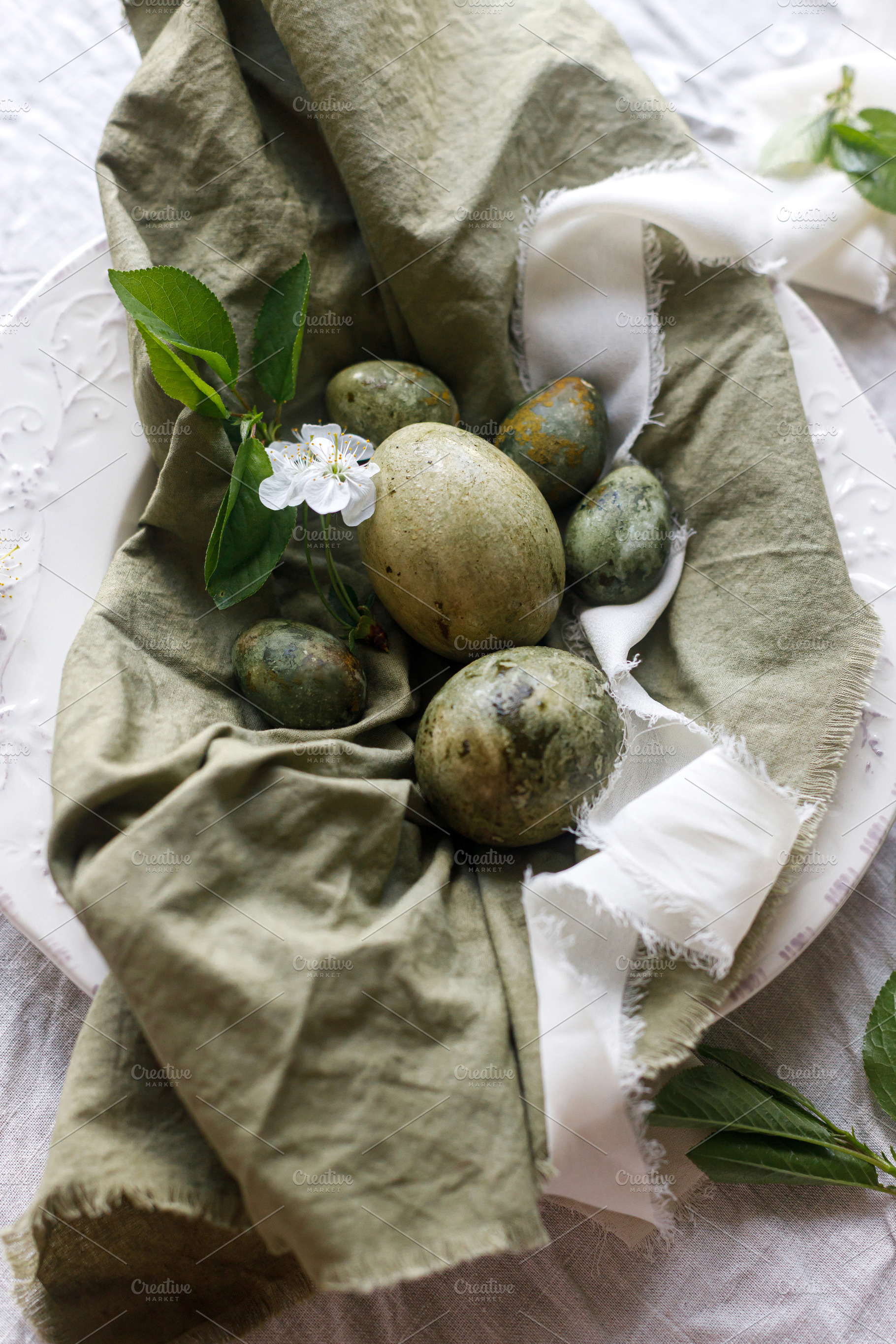 Happy Easter! Stylish natural dyed eggs and spring flowers on gr, a Holiday Photo by Sonjachni