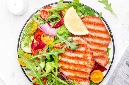Grilled tuna steak with tomatoes, arugula, onion and lettuce sal, a Food & Drink Photo by 5PH