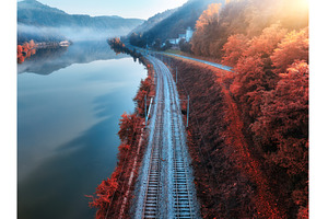 Aerial view of railroad, alpine lake, a Nature Photo by den-belitsky