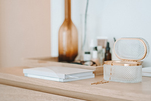 Notebook and jewelery box on dresser stock picture