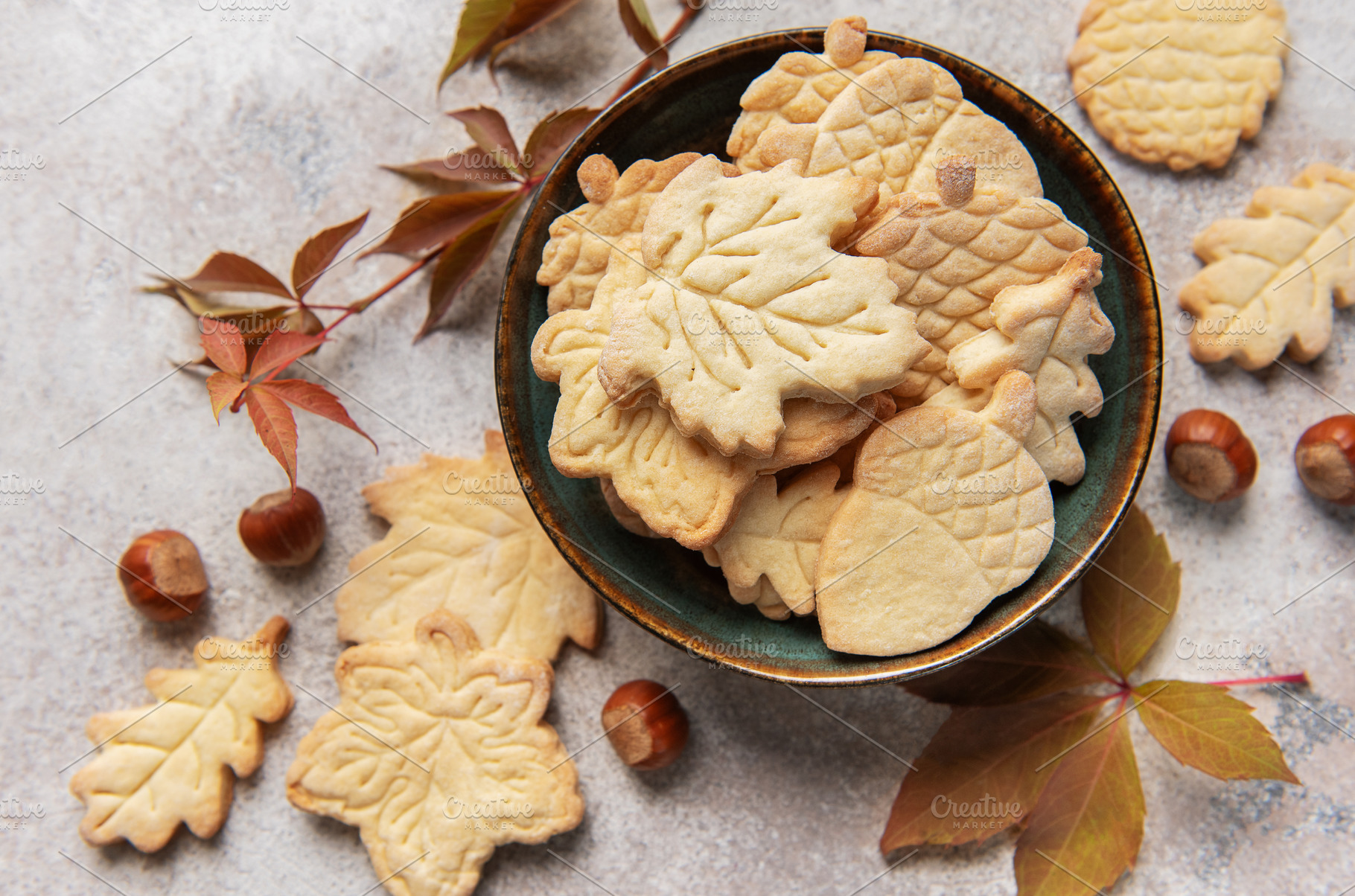Autumn cookies in bowl with fall leaves and hazelnuts, a Food & Drink Photo by Olena Rudo