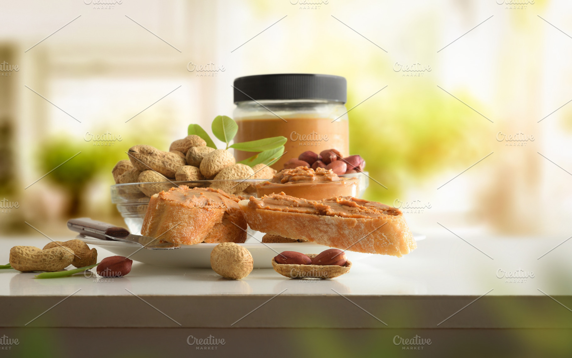 Slices of bread with peanut butter on bench in kitchen, a Food & Drink Photo by Davizro's Market