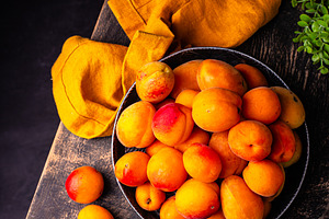 Ripe apricots on dark background, a Food & Drink Photo by Yulia Furman